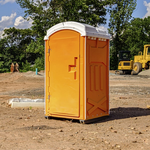 what is the cost difference between standard and deluxe portable restroom rentals in Raymond SD